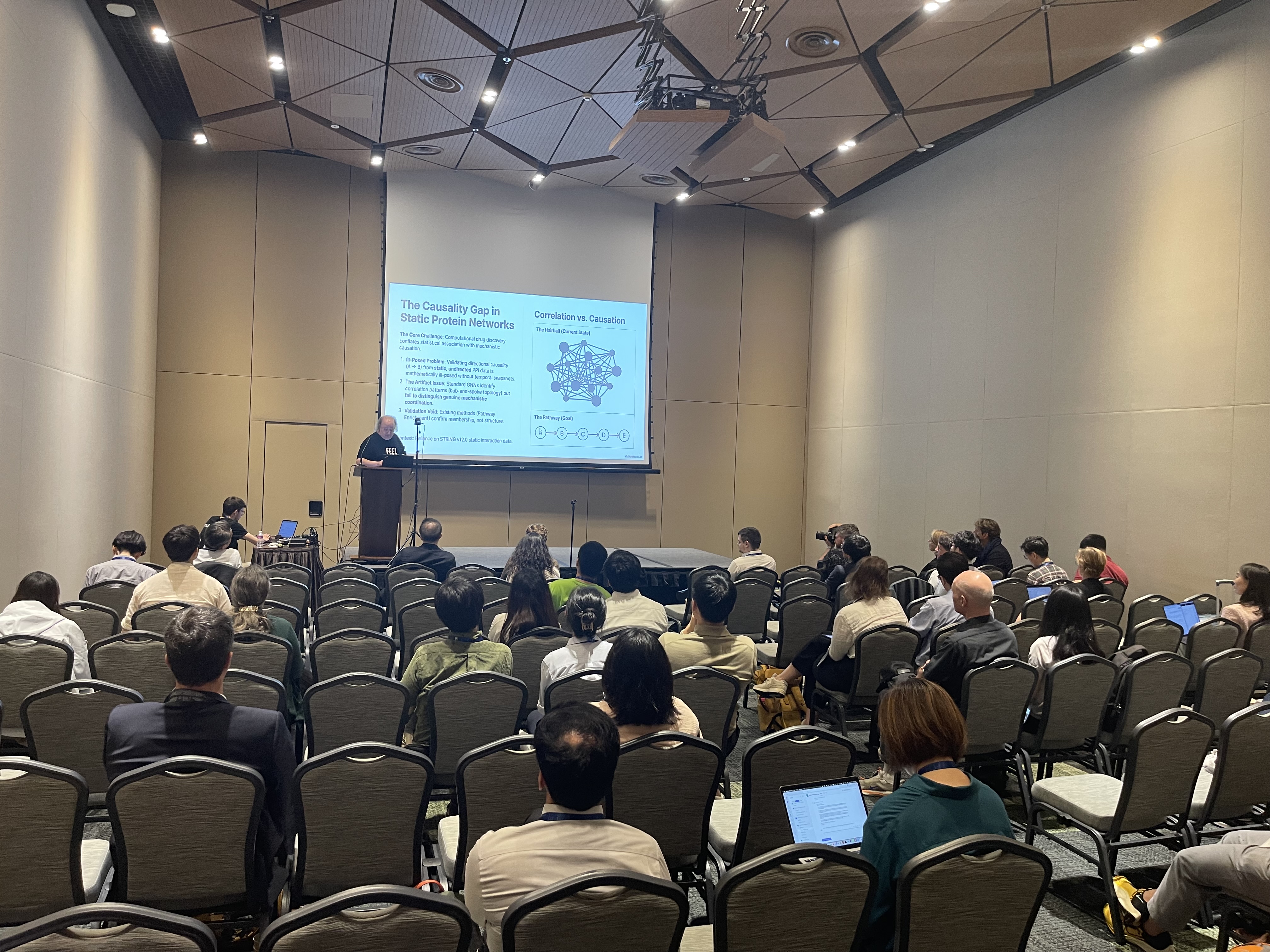 David Scott Lewis presenting protein research at AAAI-26 oral session