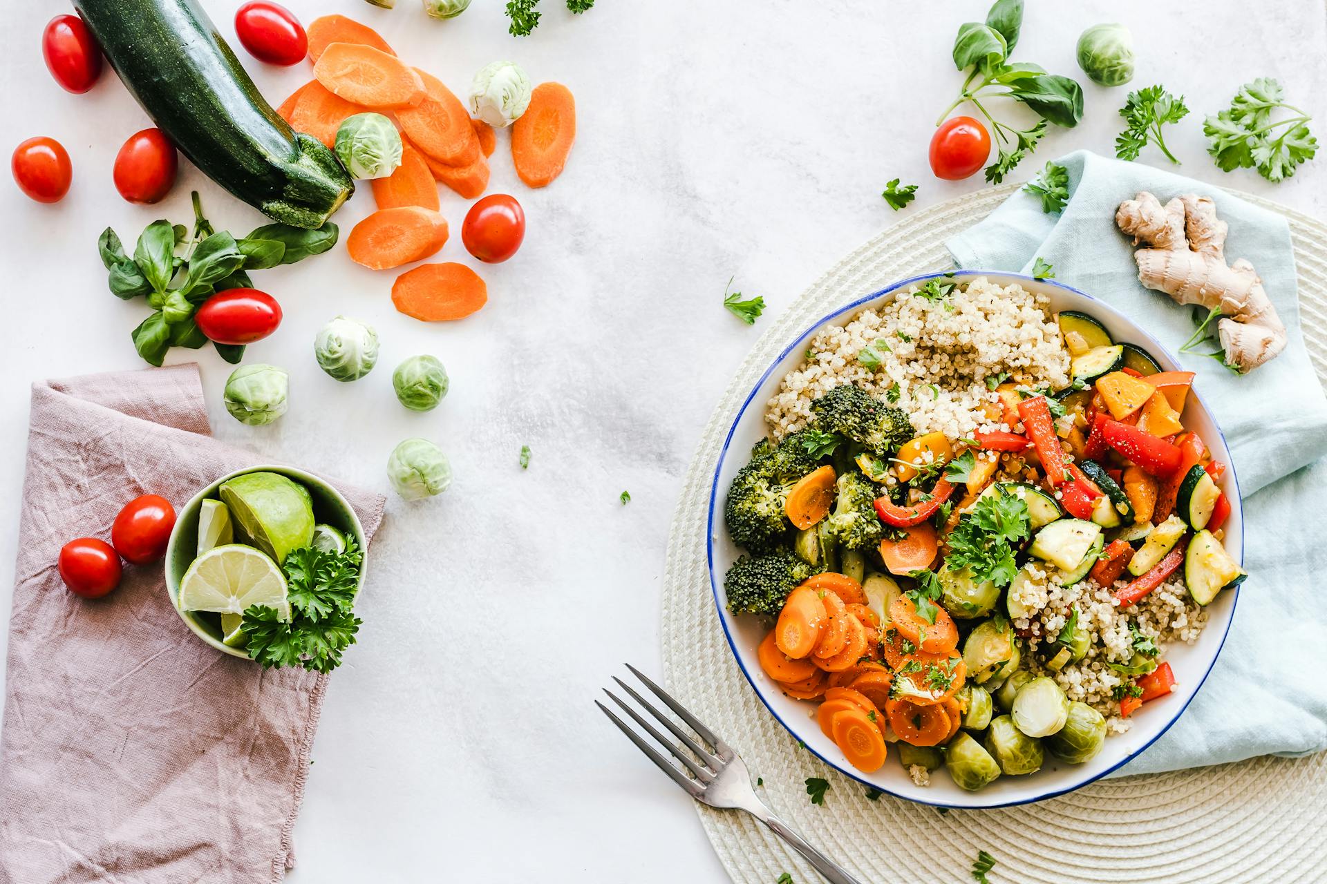 Colorful flat-lay of fresh vegetables, grains, and healthy ingredients